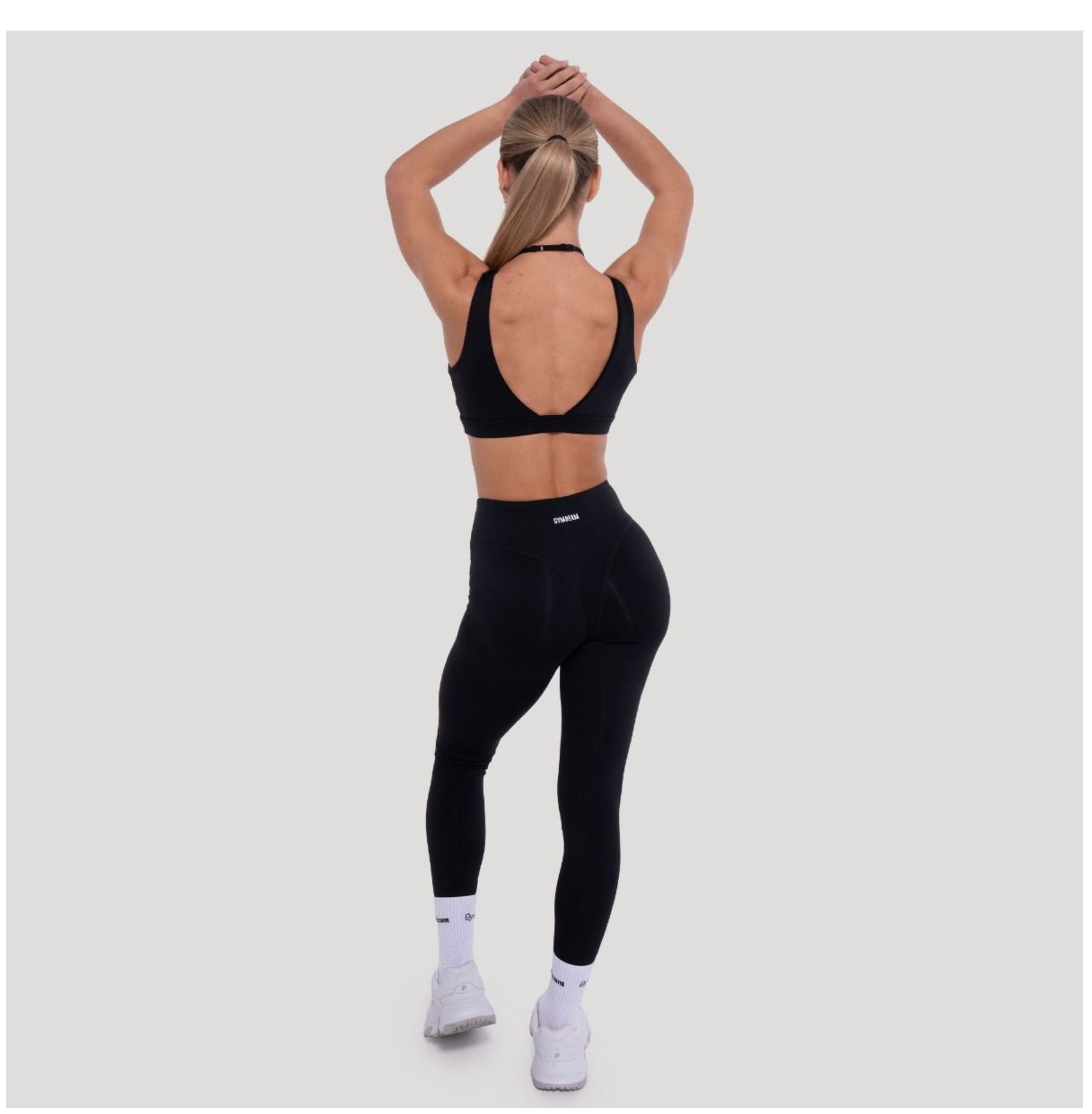 GymBeam Sport-BH FLOW in schwarz zweilagiges Design Fitness-BH mit Stützkraft & V-Ausschnitt Gr. S